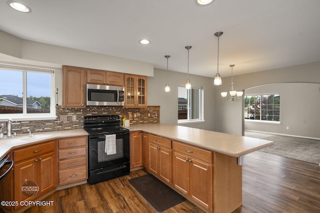 16422 Ondola Cir, Eagle River, AK 99577 - kitchen featuring stainless steel microwave, black range with electric cooktop, a peninsula, light countertops, and recessed lighting