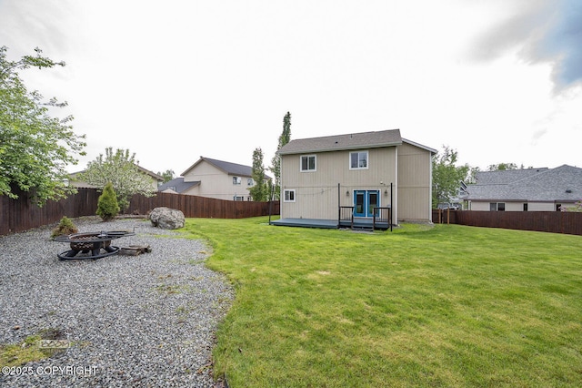16422 Ondola Cir, Eagle River, AK 99577 - back of house featuring an outdoor fire pit, a fenced backyard, and a wooden deck