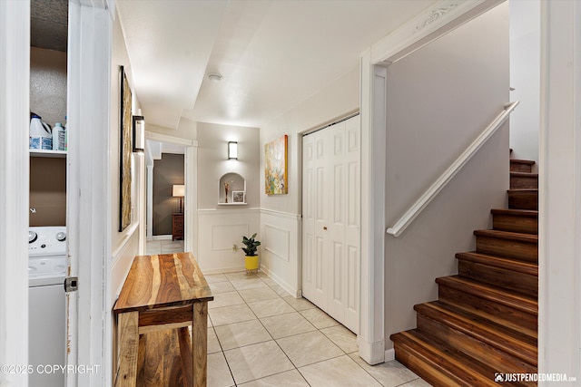 2435 N Ravens Flight Dr, Wasilla, AK 99654 - hall with stairway, light tile patterned floors, wainscoting, and a decorative wall