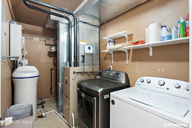 2435 N Ravens Flight Dr, Wasilla, AK 99654 - laundry room featuring independent washer and dryer and tile patterned floors