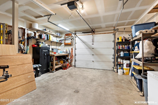 2435 N Ravens Flight Dr, Wasilla, AK 99654 - garage featuring a garage door opener and a workshop area