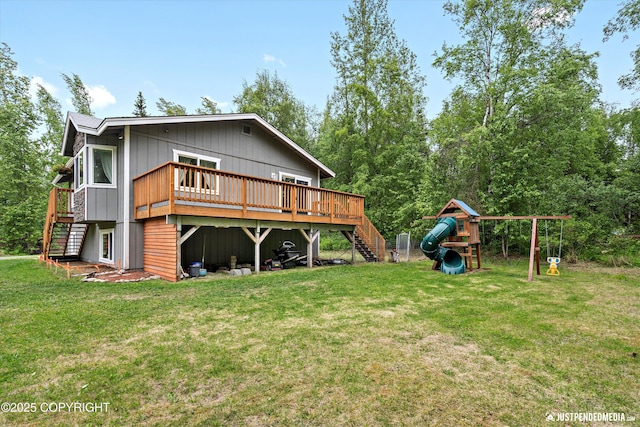 2435 N Ravens Flight Dr, Wasilla, AK 99654 - rear view of property with stairs, a lawn, a playground, and a wooden deck