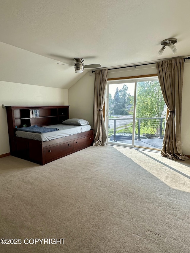 bedroom with access to outside, carpet flooring, lofted ceiling, and a ceiling fan