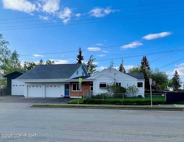 single story home with an attached garage and driveway