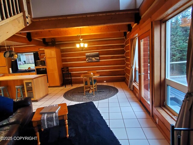 living room with log walls, light tile patterned flooring, and beam ceiling