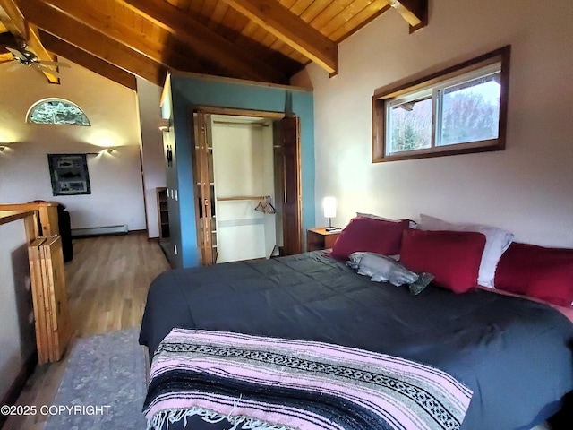 bedroom featuring wood finished floors, wooden ceiling, and a baseboard radiator