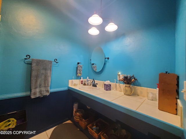 bathroom with tile patterned floors and vanity