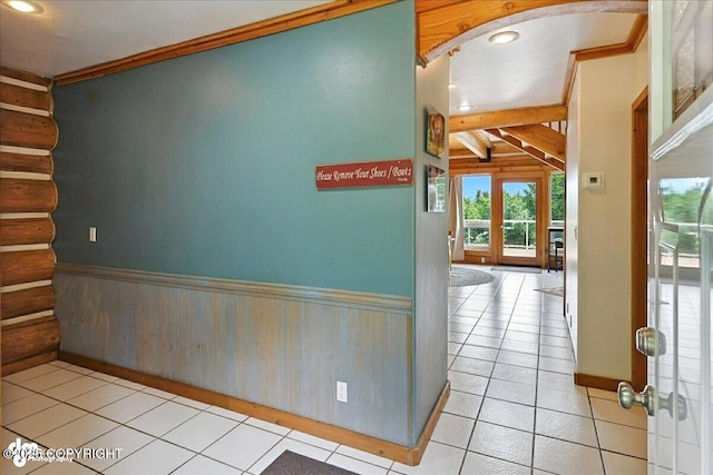 4510 Thomas Ct, Homer, AK 99603 - hall featuring rustic walls, ornamental molding, light tile patterned floors, wainscoting, and stairway