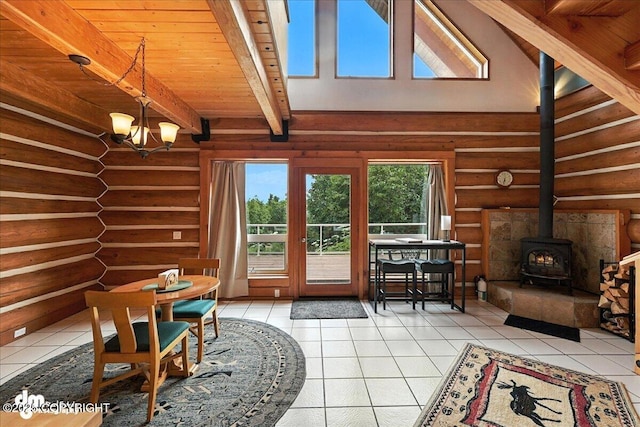4510 Thomas Ct, Homer, AK 99603 - entryway with rustic walls, a wood stove, light tile patterned floors, a chandelier, and a wooden ceiling with exposed beams