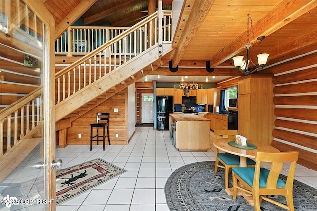 4510 Thomas Ct, Homer, AK 99603 - kitchen featuring a chandelier, freestanding refrigerator, a wooden ceiling with exposed beams, light tile patterned floors, and range