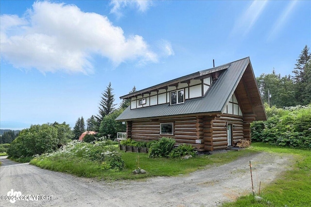 4510 Thomas Ct, Homer, AK 99603 - view of side of home featuring log siding and a metal roof