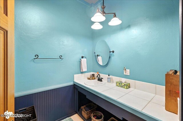 4510 Thomas Ct, Homer, AK 99603 - bathroom with vanity and a wainscoted wall