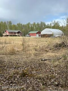 view of yard with a carport and a view of countryside