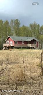 view of front of home featuring a view of trees