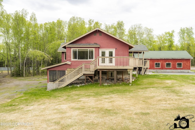 4800 W Lucy Lake Rd, Wasilla, AK 99623 - rear view of property featuring stairs, a wooden deck, and a lawn