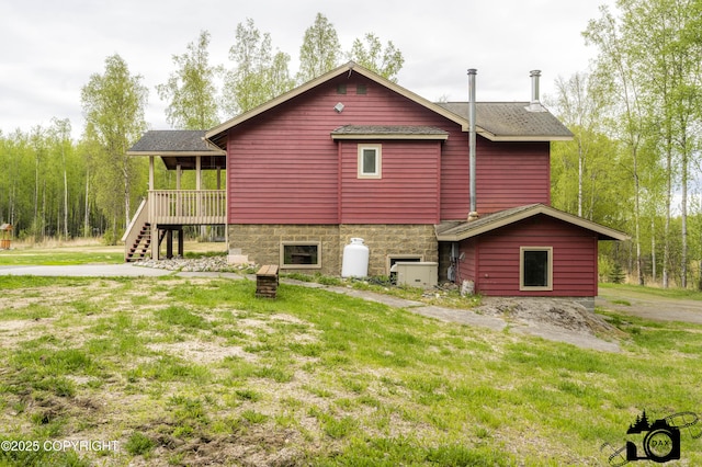 4800 W Lucy Lake Rd, Wasilla, AK 99623 - back of house featuring a deck, a lawn, stairs, and roof with shingles