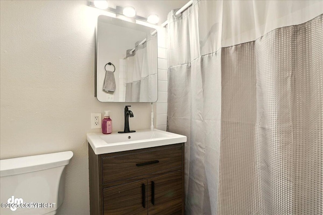 full bath with vanity and toilet