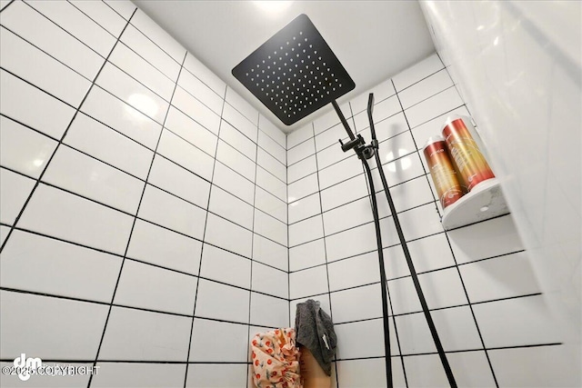 full bathroom with tiled shower