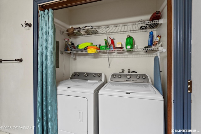washroom featuring washing machine and dryer