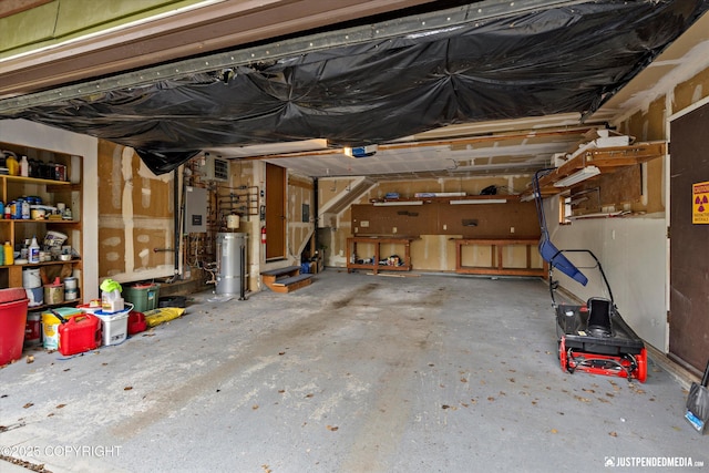 garage featuring electric panel and a garage door opener