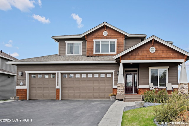 4187 Chiniak Bay Dr, Anchorage, AK 99515 - craftsman inspired home featuring driveway, a shingled roof, and a garage