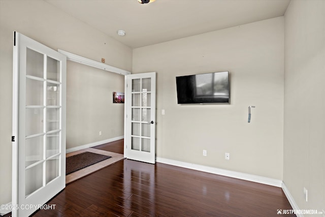 4187 Chiniak Bay Dr, Anchorage, AK 99515 - empty room featuring french doors, baseboards, wood finished floors, and a smoke detector