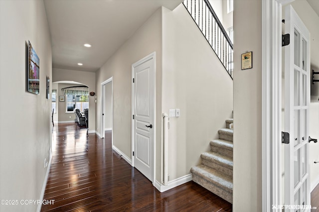 4187 Chiniak Bay Dr, Anchorage, AK 99515 - corridor with arched walkways, dark wood-style flooring, baseboards, recessed lighting, and stairway