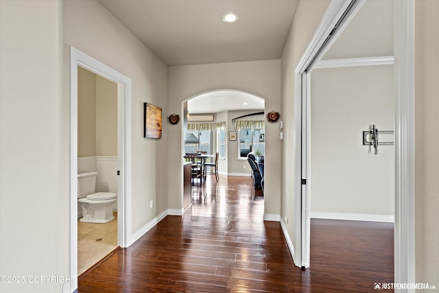 4187 Chiniak Bay Dr, Anchorage, AK 99515 - hallway with arched walkways, dark wood finished floors, recessed lighting, and baseboards