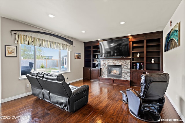 4187 Chiniak Bay Dr, Anchorage, AK 99515 - living room with baseboards, recessed lighting, wood finished floors, a fireplace, and built in shelves