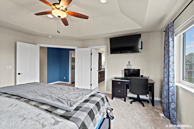 4187 Chiniak Bay Dr, Anchorage, AK 99515 - bedroom with light carpet, baseboards, a desk, a ceiling fan, and a raised ceiling