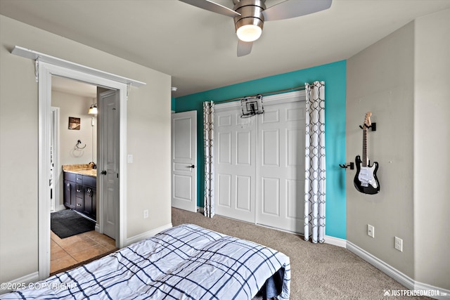 4187 Chiniak Bay Dr, Anchorage, AK 99515 - bedroom featuring a closet, light carpet, baseboards, ceiling fan, and ensuite bathroom