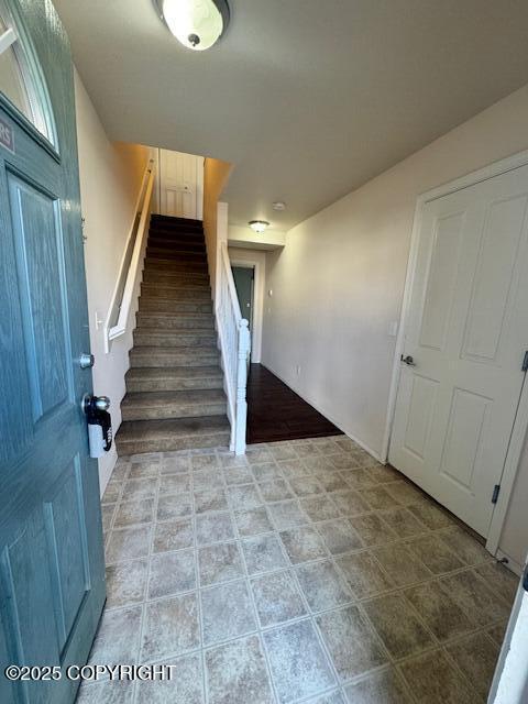 foyer featuring stairs
