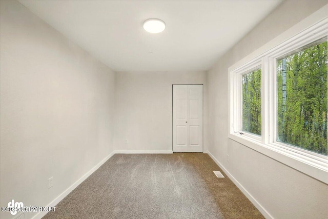 2411 N Friar Tuck Ct, Big Lake, AK 99623 - carpeted spare room featuring baseboards
