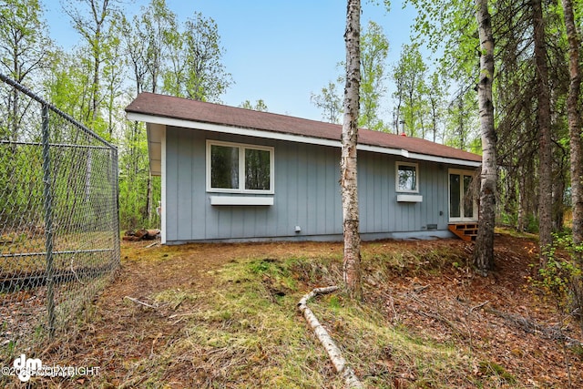 2411 N Friar Tuck Ct, Big Lake, AK 99623 - view of home's exterior featuring fence, board and batten siding, and entry steps