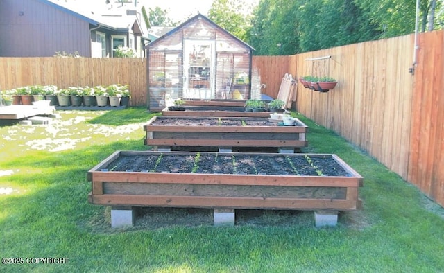 9500 Aphrodite Dr, Anchorage, AK 99515 - deck featuring a garden, a greenhouse, and an outbuilding