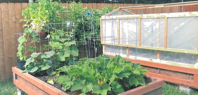 9500 Aphrodite Dr, Anchorage, AK 99515 - exterior view of a vegetable garden and fence