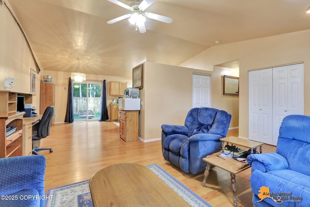 9500 Aphrodite Dr, Anchorage, AK 99515 - living room with a desk, light wood-style floors, a ceiling fan, baseboards, and lofted ceiling