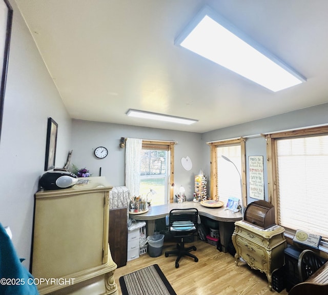 home office featuring light wood-style floors
