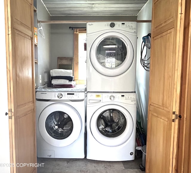 laundry area with stacked washing machine and dryer