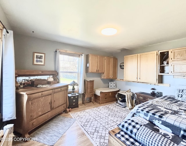 kitchen with light wood-style flooring, light countertops, and light brown cabinetry