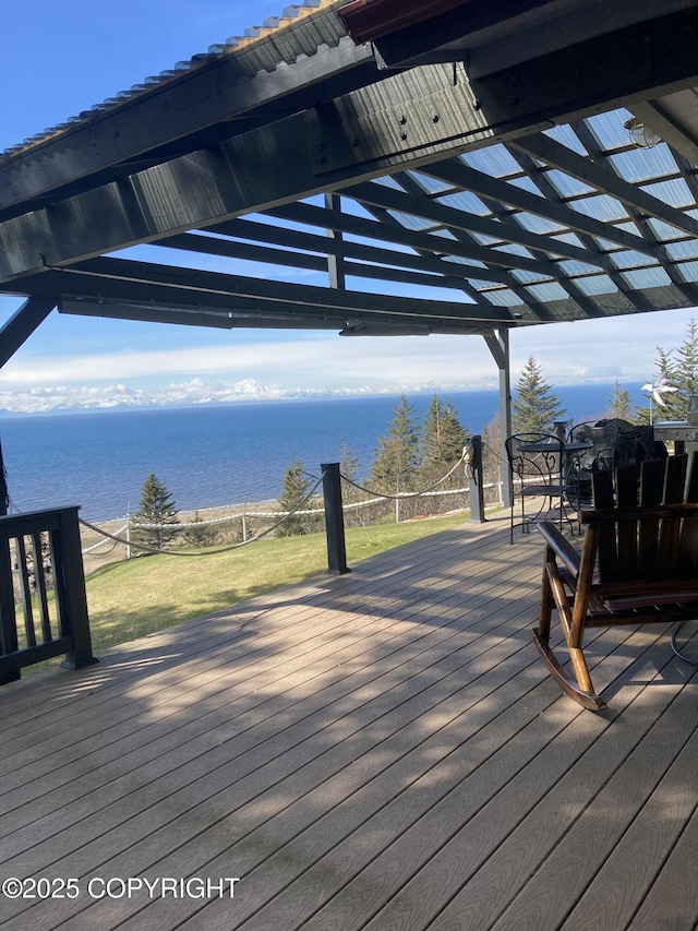 wooden deck featuring a water view