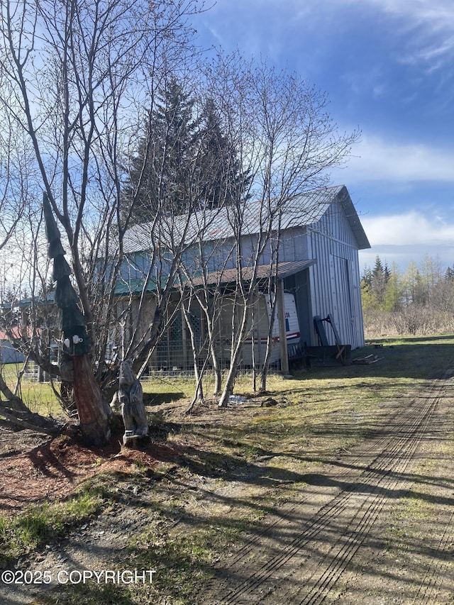 back of property with board and batten siding