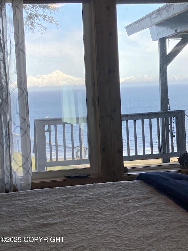 bedroom featuring a water view