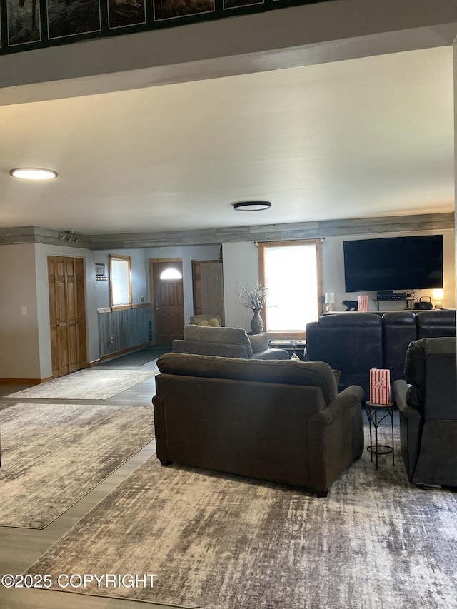 living area with crown molding