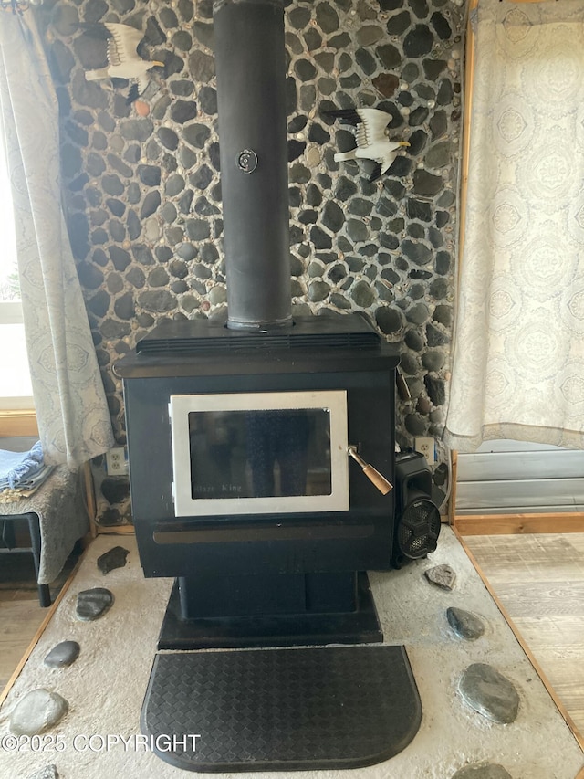 detailed view of a wood stove and wood finished floors