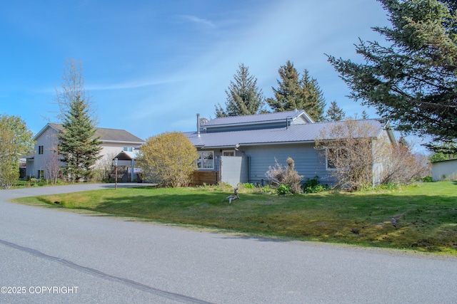 255 Lee Dr, Homer, AK 99603 - view of front of property featuring a front yard and metal roof