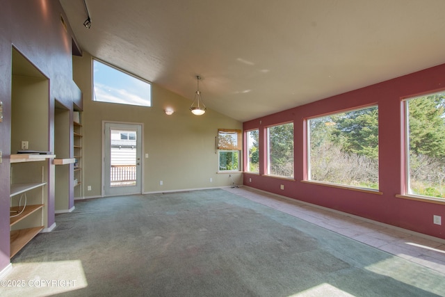 255 Lee Dr, Homer, AK 99603 - carpeted empty room featuring healthy amount of natural light, vaulted ceiling, and baseboards