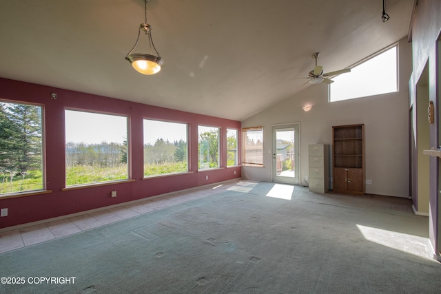 255 Lee Dr, Homer, AK 99603 - unfurnished sunroom featuring healthy amount of natural light, carpet floors, baseboards, high vaulted ceiling, and tile patterned floors