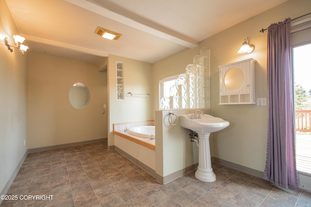 255 Lee Dr, Homer, AK 99603 - full bathroom with a garden tub, beamed ceiling, and baseboards