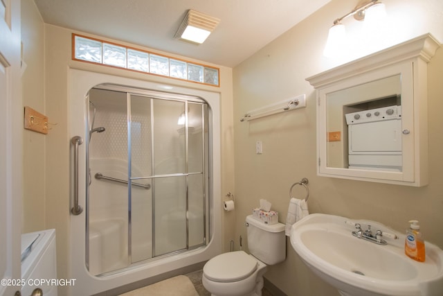 255 Lee Dr, Homer, AK 99603 - bathroom featuring a sink, a stall shower, and toilet